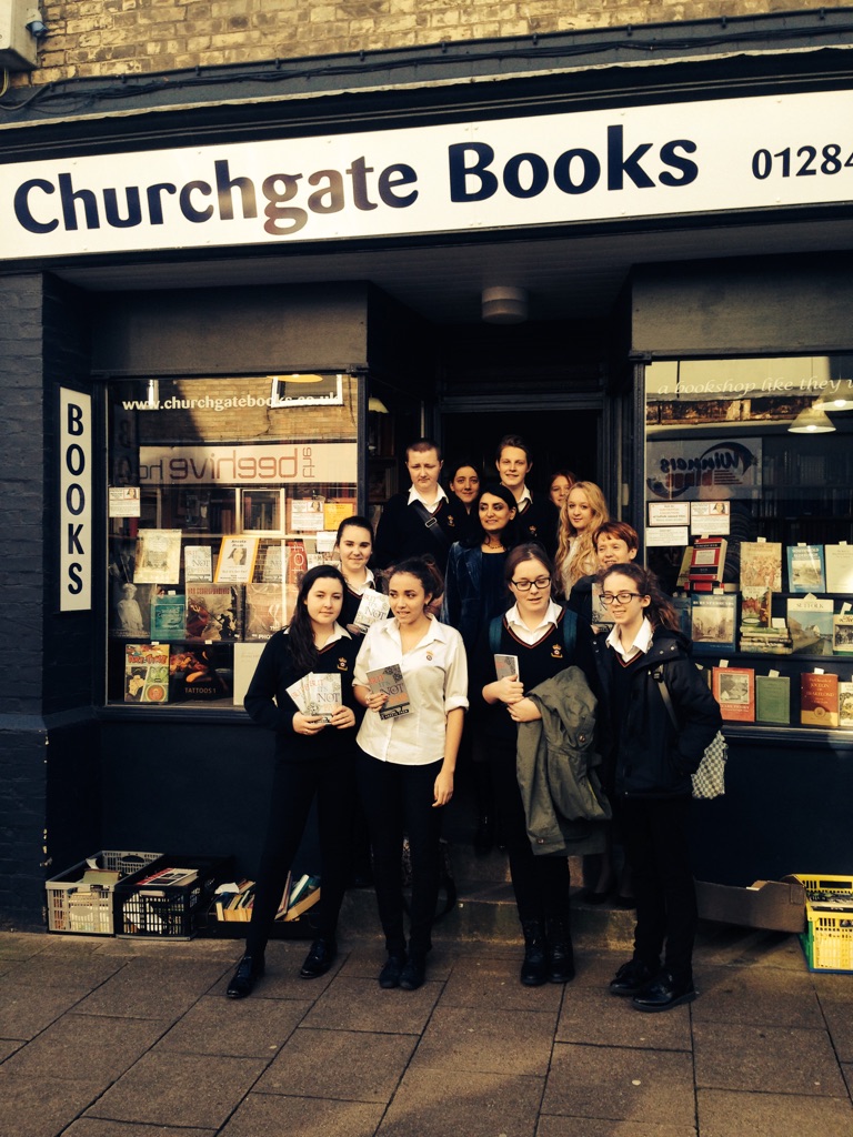Aneeta Prem and pupils outside Churchgate Books with copies of But It's Not Fair