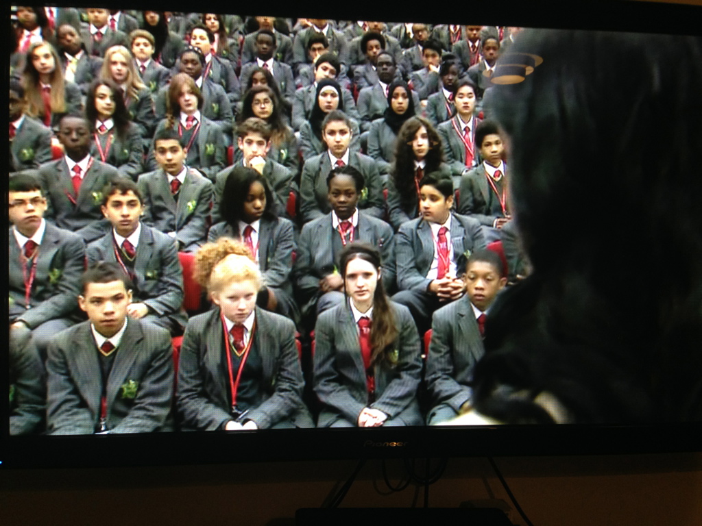 A large school audience during a recorded forced marriage assembly