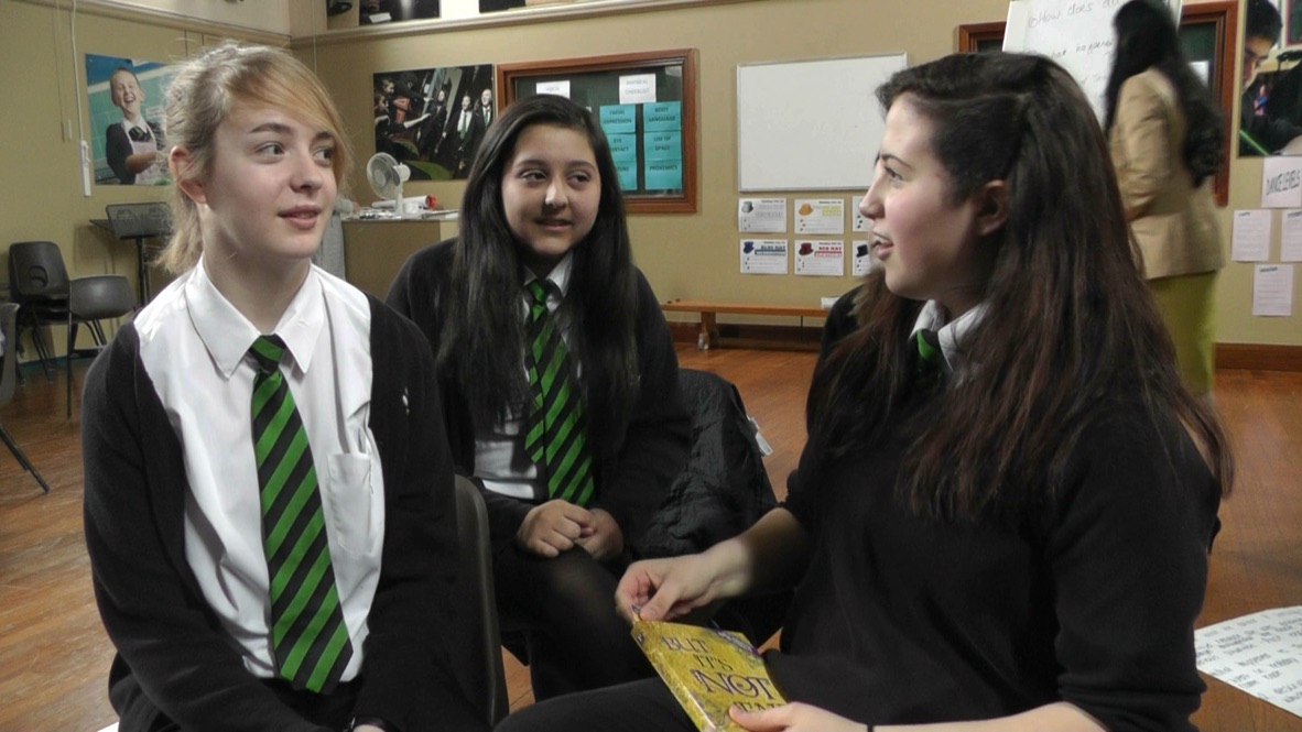 Three pupils discussing But It's Not Fair